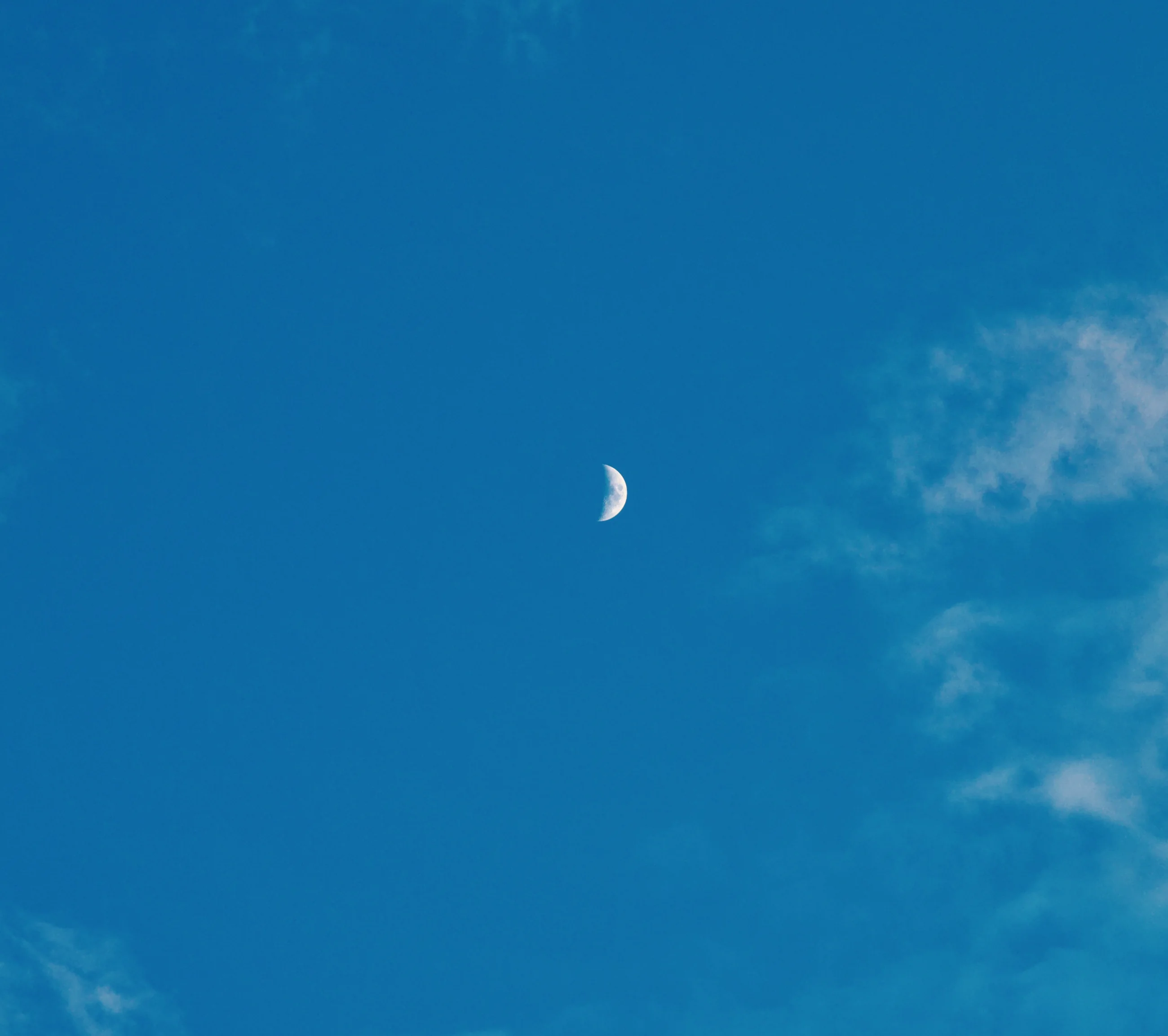 Crescent moon in a vivid blue sky