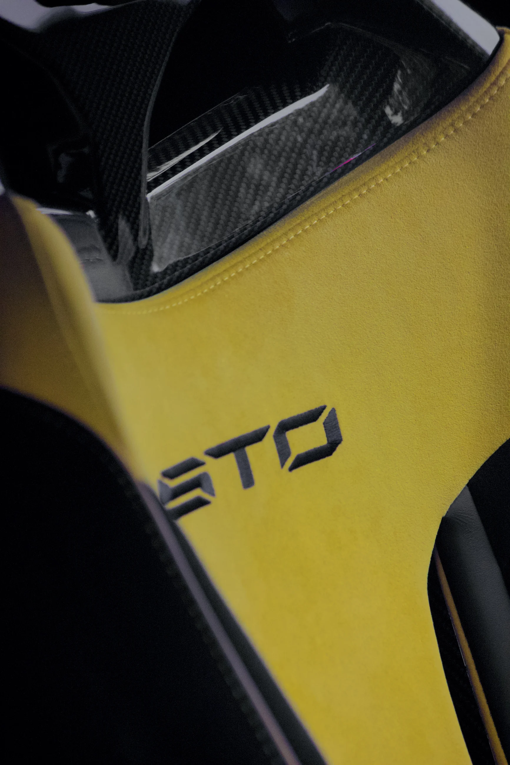 Yellow and black STO bodywork photographed close up